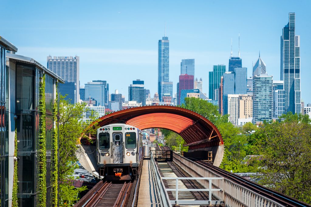 Picture of train with city skyline